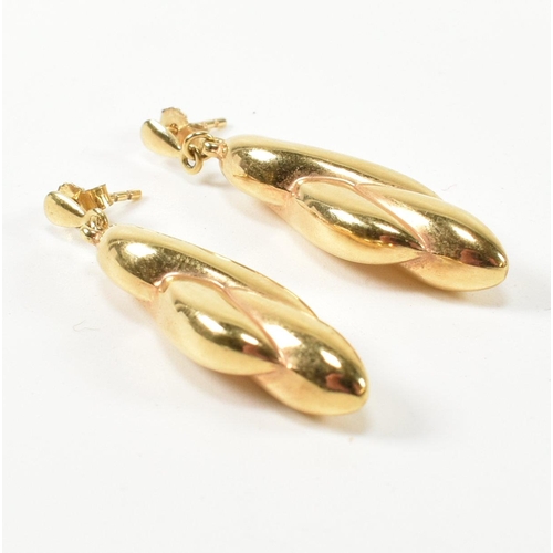 320 - A pair of hallmarked 9ct gold pendant earrings. The 9ct earrings having twisted design pendants to s... 