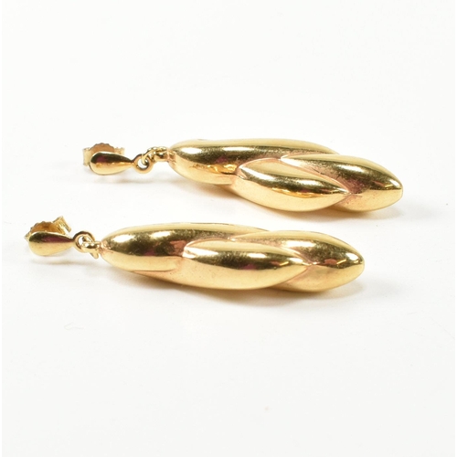 320 - A pair of hallmarked 9ct gold pendant earrings. The 9ct earrings having twisted design pendants to s... 