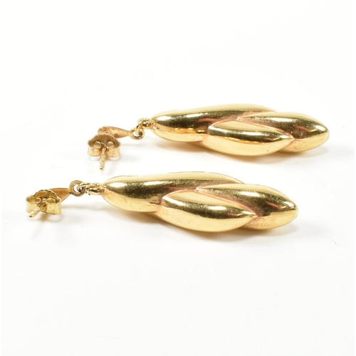 320 - A pair of hallmarked 9ct gold pendant earrings. The 9ct earrings having twisted design pendants to s... 