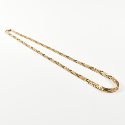 323 - A hallmarked 9ct gold three colour gold plaited herringbone necklace. The necklace having three plai... 