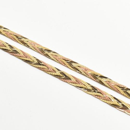 323 - A hallmarked 9ct gold three colour gold plaited herringbone necklace. The necklace having three plai... 