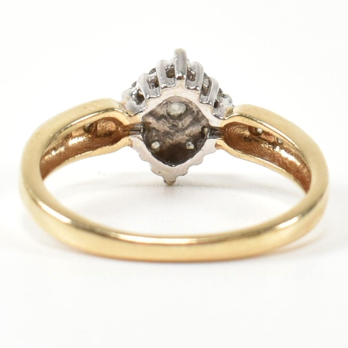 324 - A hallmarked 9ct gold and diamond cluster ring. The ring having a central round brilliant cut diamon... 