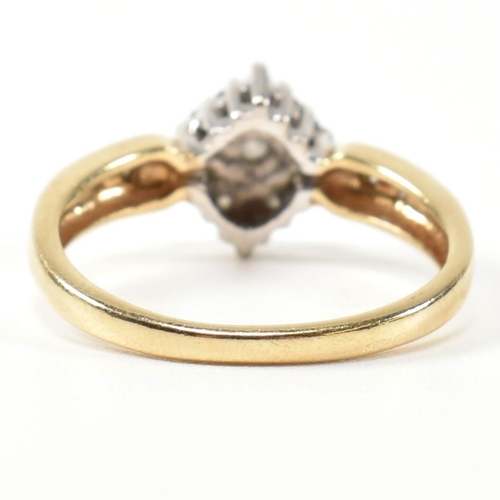 324 - A hallmarked 9ct gold and diamond cluster ring. The ring having a central round brilliant cut diamon... 