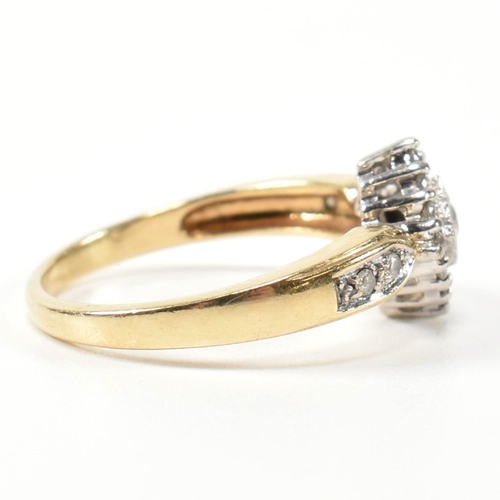 324 - A hallmarked 9ct gold and diamond cluster ring. The ring having a central round brilliant cut diamon... 