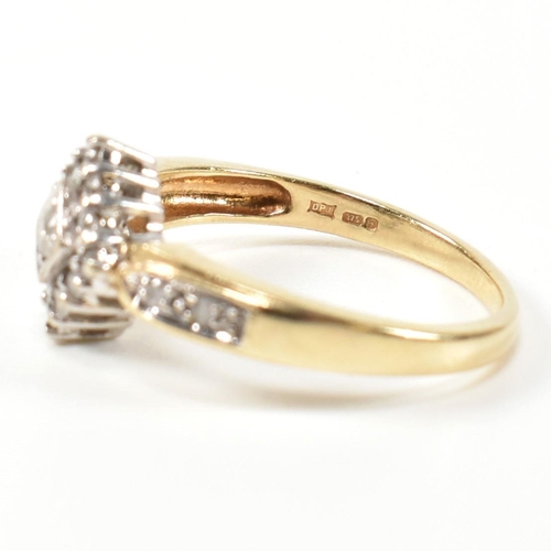 324 - A hallmarked 9ct gold and diamond cluster ring. The ring having a central round brilliant cut diamon... 