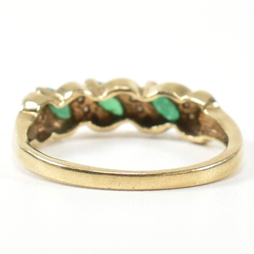 328 - A 9ct gold, diamond and emerald twist band ring. The ring set with three marquise cut emeralds inter... 