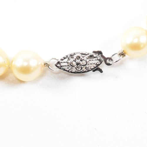 331 - 14ct white gold and cultured pearl necklace. The necklace strung with a single row of cultured pearl... 