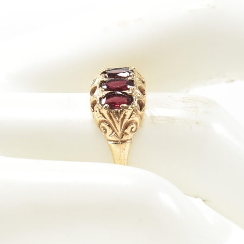 332 - A hallmarked 9ct gold and garnet five stone half hoop ring. The 9ct gold ring having five oval cut g... 