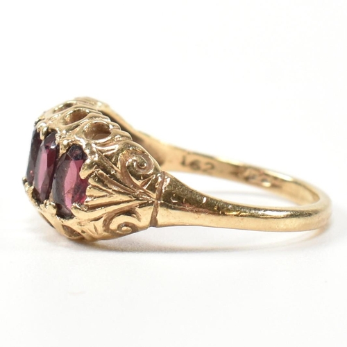 332 - A hallmarked 9ct gold and garnet five stone half hoop ring. The 9ct gold ring having five oval cut g... 