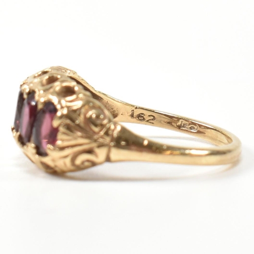 332 - A hallmarked 9ct gold and garnet five stone half hoop ring. The 9ct gold ring having five oval cut g... 