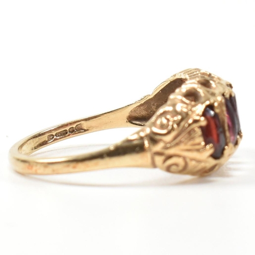 332 - A hallmarked 9ct gold and garnet five stone half hoop ring. The 9ct gold ring having five oval cut g... 