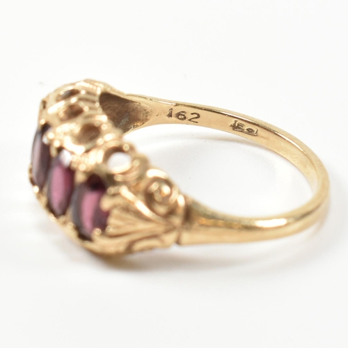 332 - A hallmarked 9ct gold and garnet five stone half hoop ring. The 9ct gold ring having five oval cut g... 