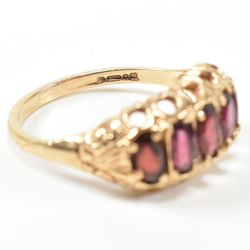 332 - A hallmarked 9ct gold and garnet five stone half hoop ring. The 9ct gold ring having five oval cut g... 