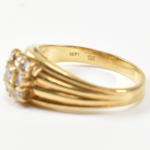 333 - A hallmarked 18ct gold and diamond signet ring. The ring having a central round cut diamond surround... 