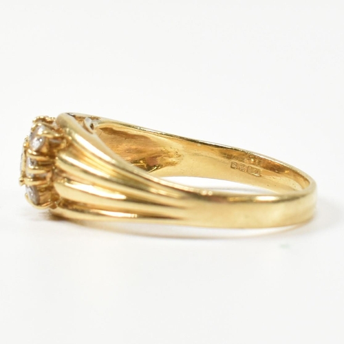 333 - A hallmarked 18ct gold and diamond signet ring. The ring having a central round cut diamond surround... 