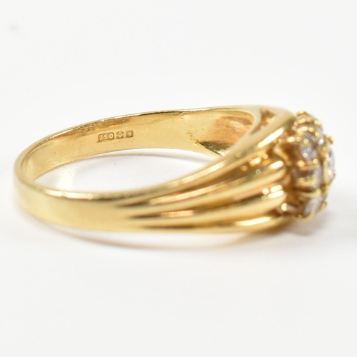 333 - A hallmarked 18ct gold and diamond signet ring. The ring having a central round cut diamond surround... 