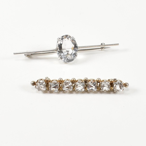 334 - Two white stone set brooch pins. The brooches to include a silver bar brooch set with a double claw ... 