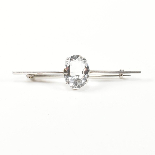 334 - Two white stone set brooch pins. The brooches to include a silver bar brooch set with a double claw ... 