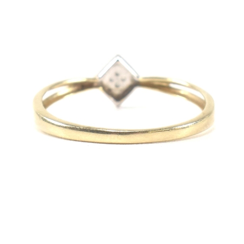 336 - A 9ct gold and diamond cluster ring. The ring having a 9ct white gold rhombus shape mount set with p... 