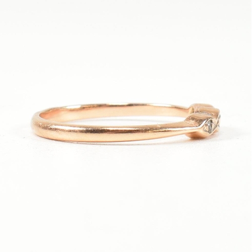 338 - A hallmarked 14ct rose gold and white stone ring. The rose gold ring set with three round cut white ... 