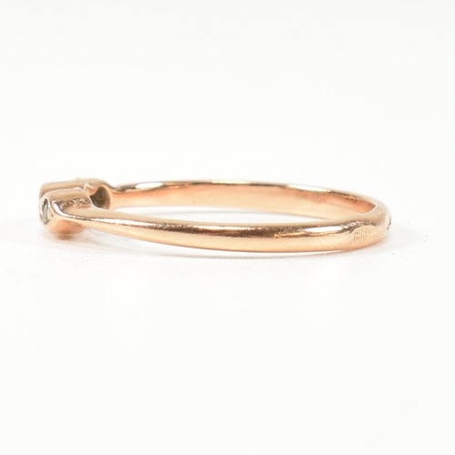 338 - A hallmarked 14ct rose gold and white stone ring. The rose gold ring set with three round cut white ... 