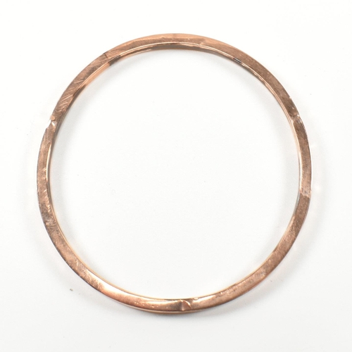 339 - A hallmarked 9ct rose gold bangle bracelet. The flat 9ct rose gold bangle, hallmarked for Birmingham... 