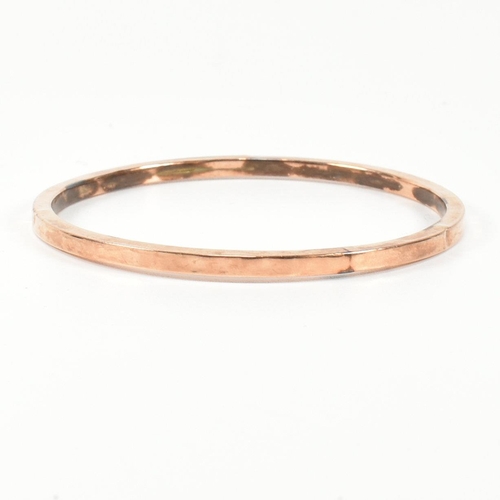 339 - A hallmarked 9ct rose gold bangle bracelet. The flat 9ct rose gold bangle, hallmarked for Birmingham... 