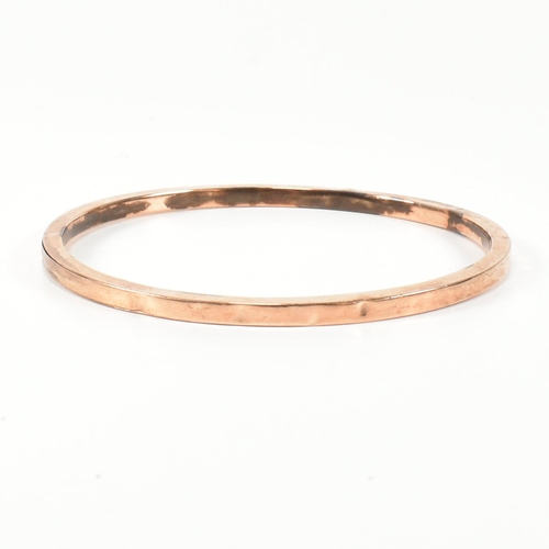 339 - A hallmarked 9ct rose gold bangle bracelet. The flat 9ct rose gold bangle, hallmarked for Birmingham... 