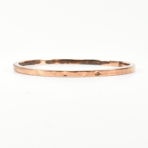 339 - A hallmarked 9ct rose gold bangle bracelet. The flat 9ct rose gold bangle, hallmarked for Birmingham... 