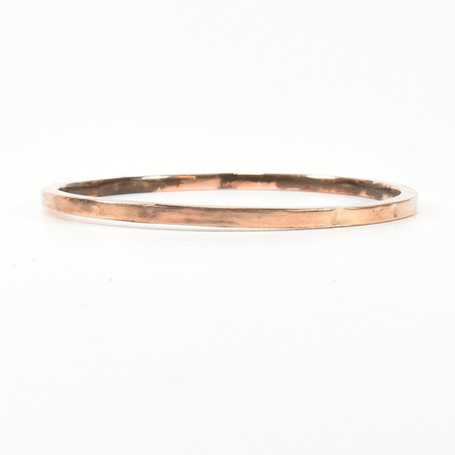 339 - A hallmarked 9ct rose gold bangle bracelet. The flat 9ct rose gold bangle, hallmarked for Birmingham... 