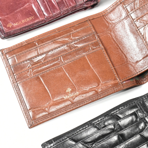 341 - Three Mulberry card wallets. The lot to include a Mulberry 10 card ID wallet in Bordeaux reptile pri... 