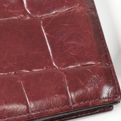 341 - Three Mulberry card wallets. The lot to include a Mulberry 10 card ID wallet in Bordeaux reptile pri... 