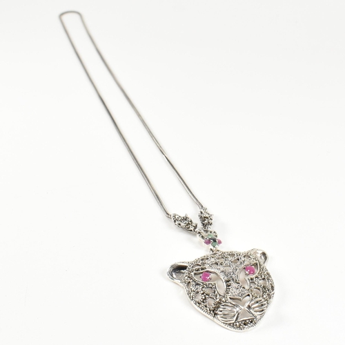 343 - A silver gem set leopards head pendant necklace. The pendant set with ruby marcasite. Marked 925. Me... 