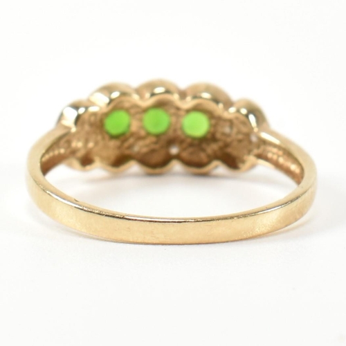 345 - A hallmarked 9ct gold, diopside and diamond three stone ring. The ring having three round cut diopsi... 