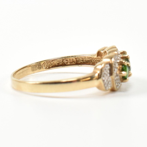 345 - A hallmarked 9ct gold, diopside and diamond three stone ring. The ring having three round cut diopsi... 