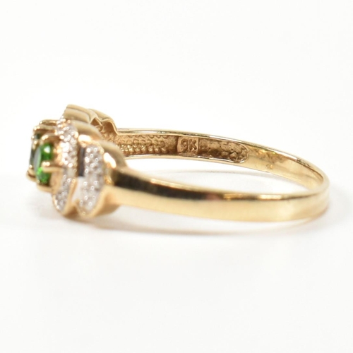 345 - A hallmarked 9ct gold, diopside and diamond three stone ring. The ring having three round cut diopsi... 