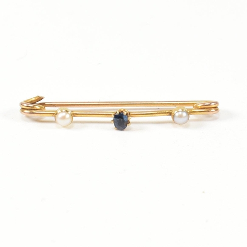 346 - A gold, sapphire and pearl brooch pin. The brooch pin set with a central oval cut sapphire flanked b... 