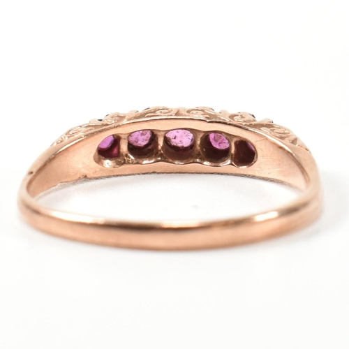 348 - A hallmarked 9ct rose gold and ruby five stone gypsy ring. The ring having five graduating round cut... 