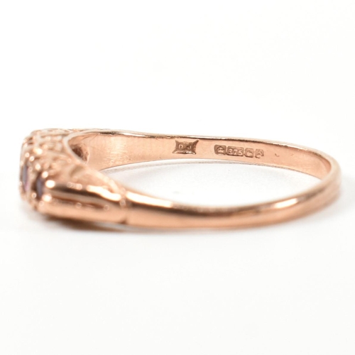 348 - A hallmarked 9ct rose gold and ruby five stone gypsy ring. The ring having five graduating round cut... 