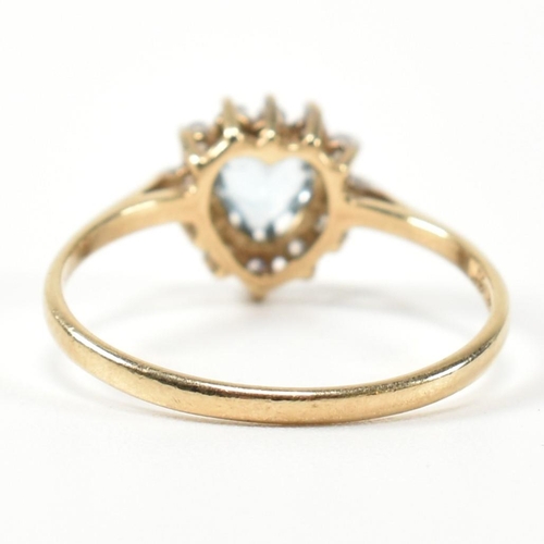 349 - A hallmarked 9ct gold, topaz and CZ heart cluster ring. The 9ct gold set with a central heart cut to... 