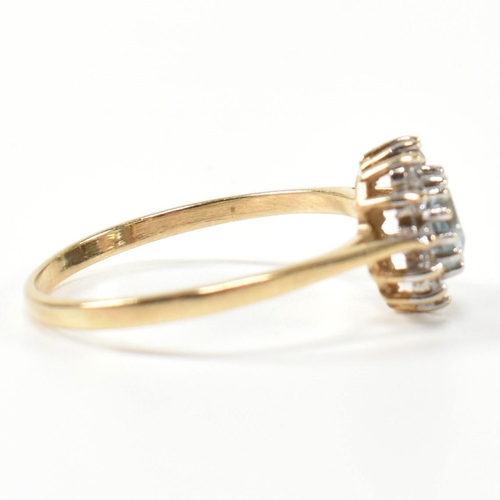 349 - A hallmarked 9ct gold, topaz and CZ heart cluster ring. The 9ct gold set with a central heart cut to... 