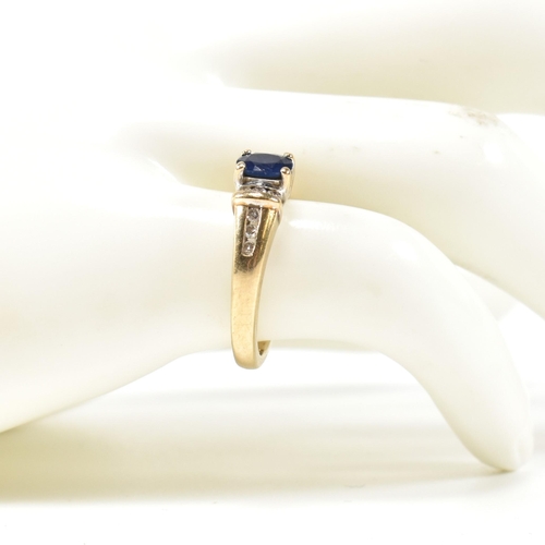 351 - A hallmarked 9ct gold, sapphire and diamond ring. The 9ct gold ring having a central trellis set ova... 