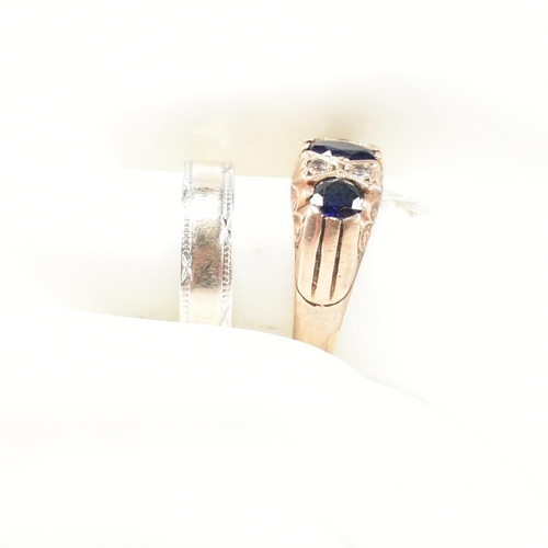 355 - Two hallmarked 9ct gold and gem set rings. The rings to include a hallmarked 9ct gold, synthetic sap... 