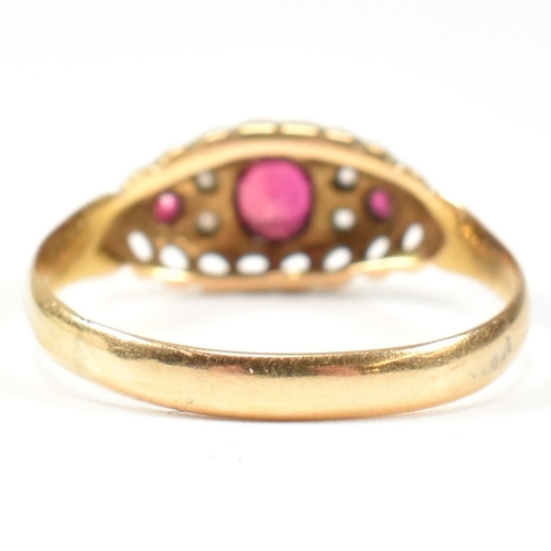 36 - An Edwardian hallmarked 18ct gold ruby and diamond ring. The ring set with a central oval cut ruby f... 