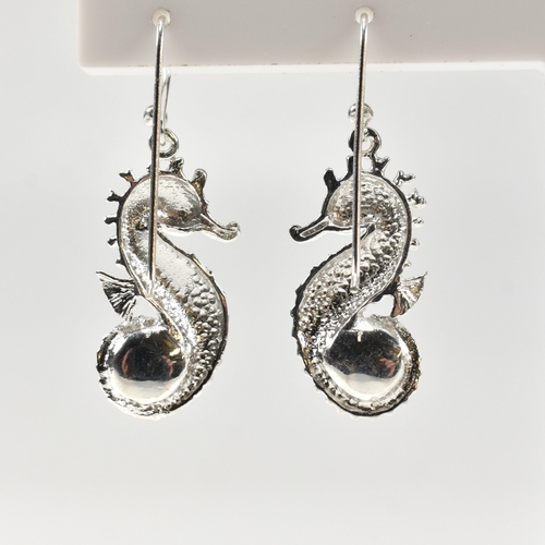 362 - A pair of silver and pearl set earrings in the form of sea horses. Unmarked. Measures 2.5cm. All wei... 