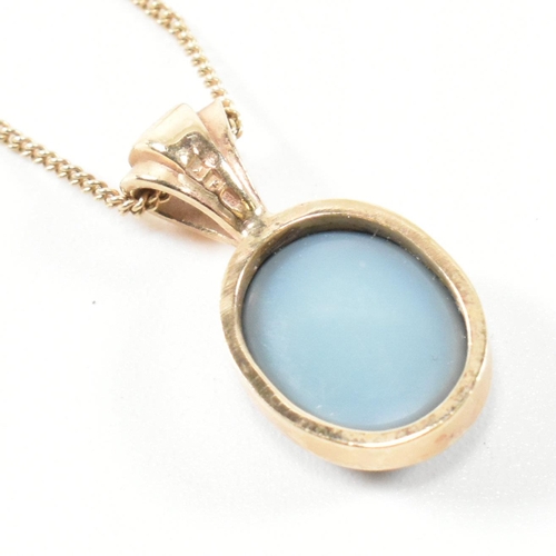 363 - A hallmarked 9ct gold and opal doublet pendant necklace. The necklace having a bezel set opal double... 