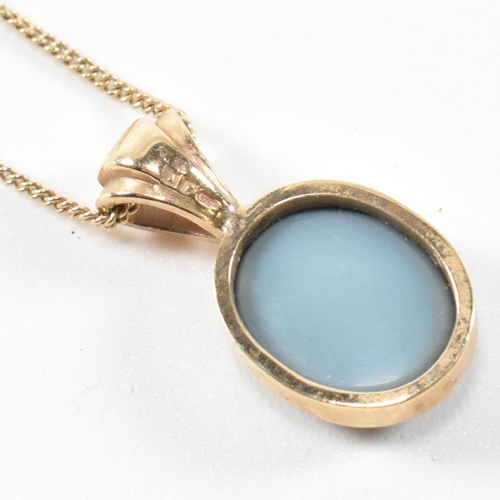 363 - A hallmarked 9ct gold and opal doublet pendant necklace. The necklace having a bezel set opal double... 