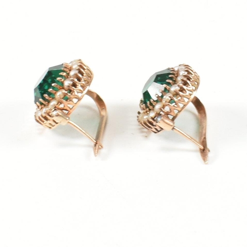 364 - A pair of 14ct gold, pearl and green paste earrings. The drop earrings having a central round cut gr... 