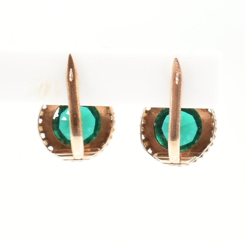 364 - A pair of 14ct gold, pearl and green paste earrings. The drop earrings having a central round cut gr... 