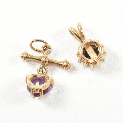 368 - Two gold and gem set necklace pendants. The necklace pendants to include a gold pendant with a heart... 